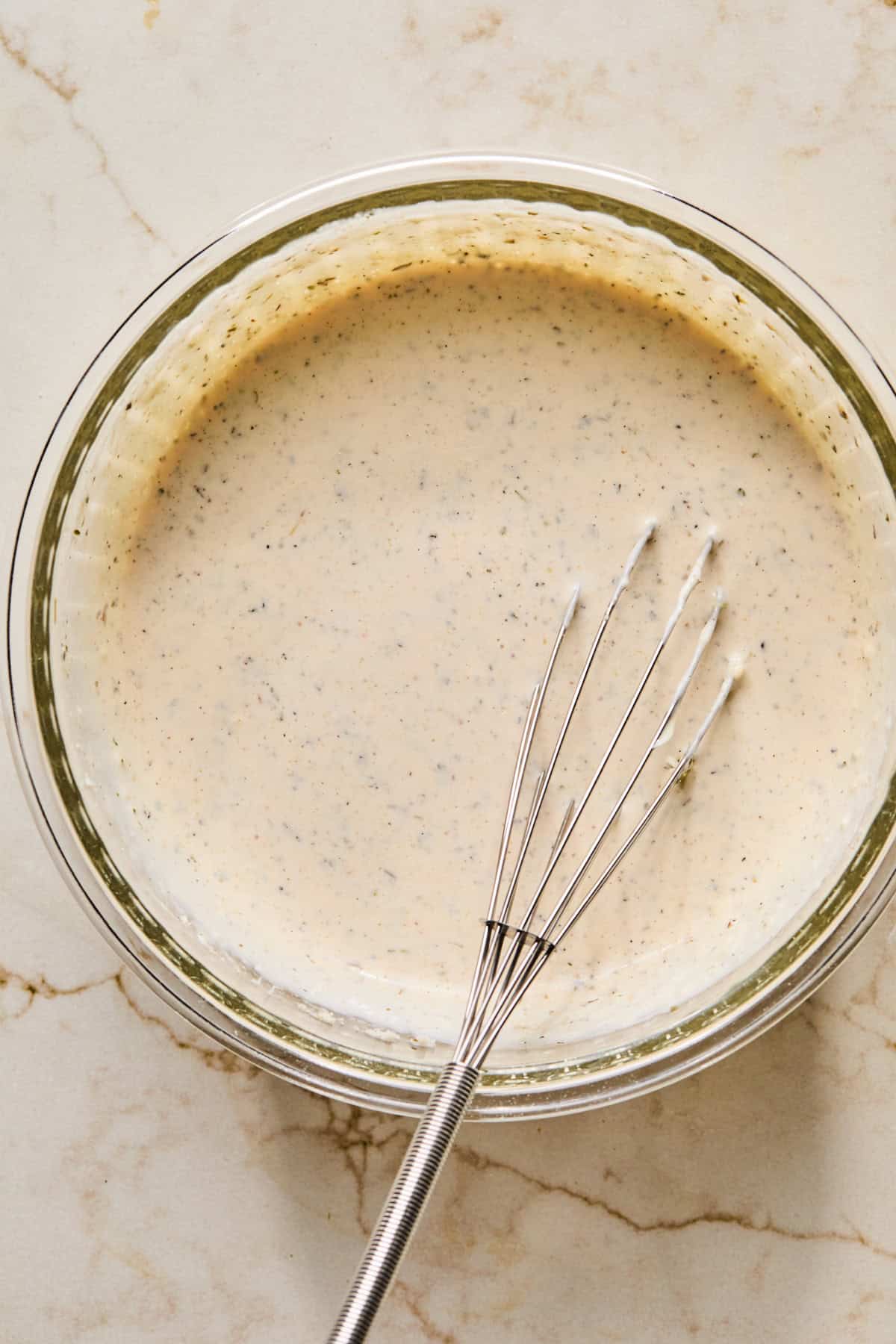 Mayonnaise, red wine vinegar, parmesan and seasoning in bowl..