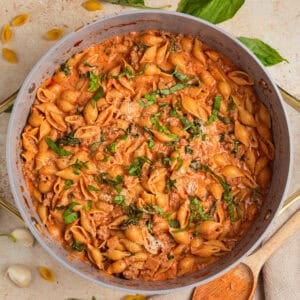Creamy tomato and turkey pasta in pot.