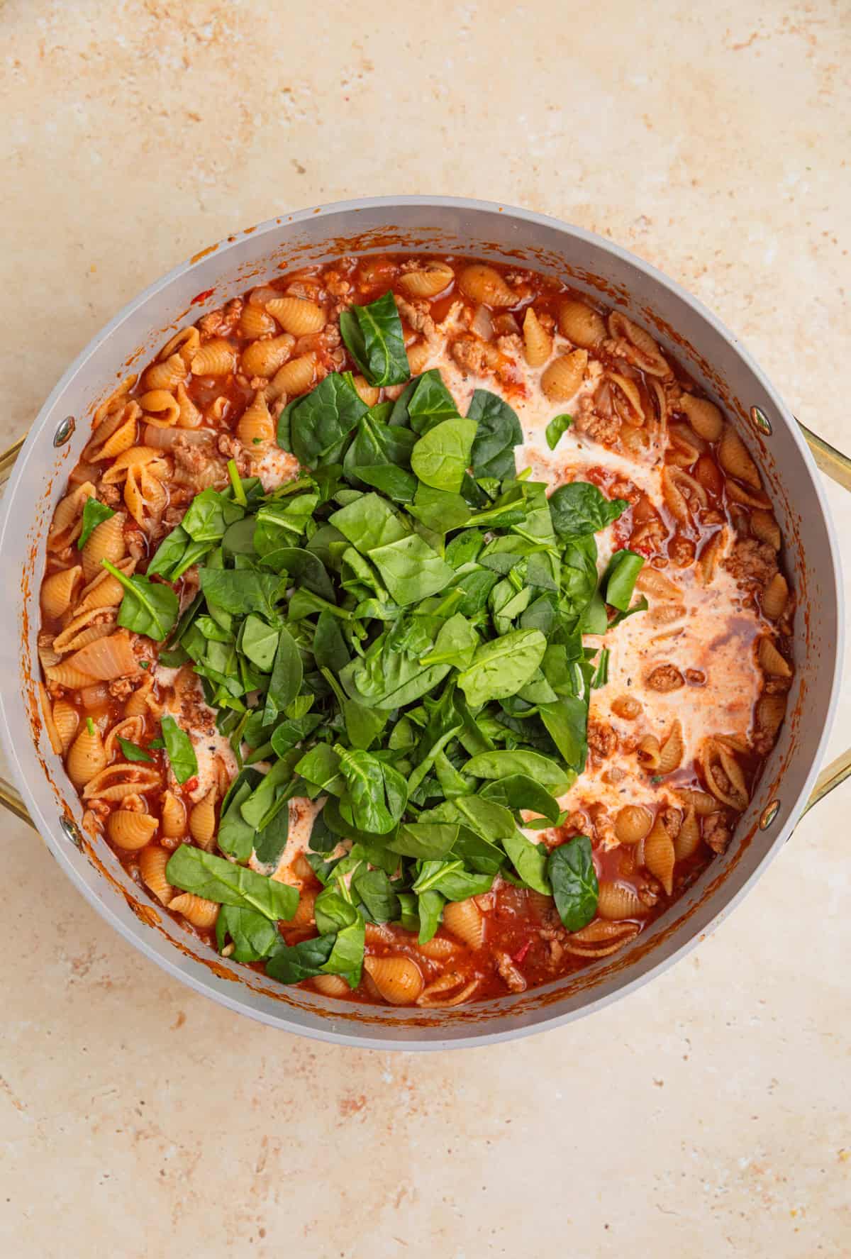 Spinach, cream and parmesan added to one pot pasta.