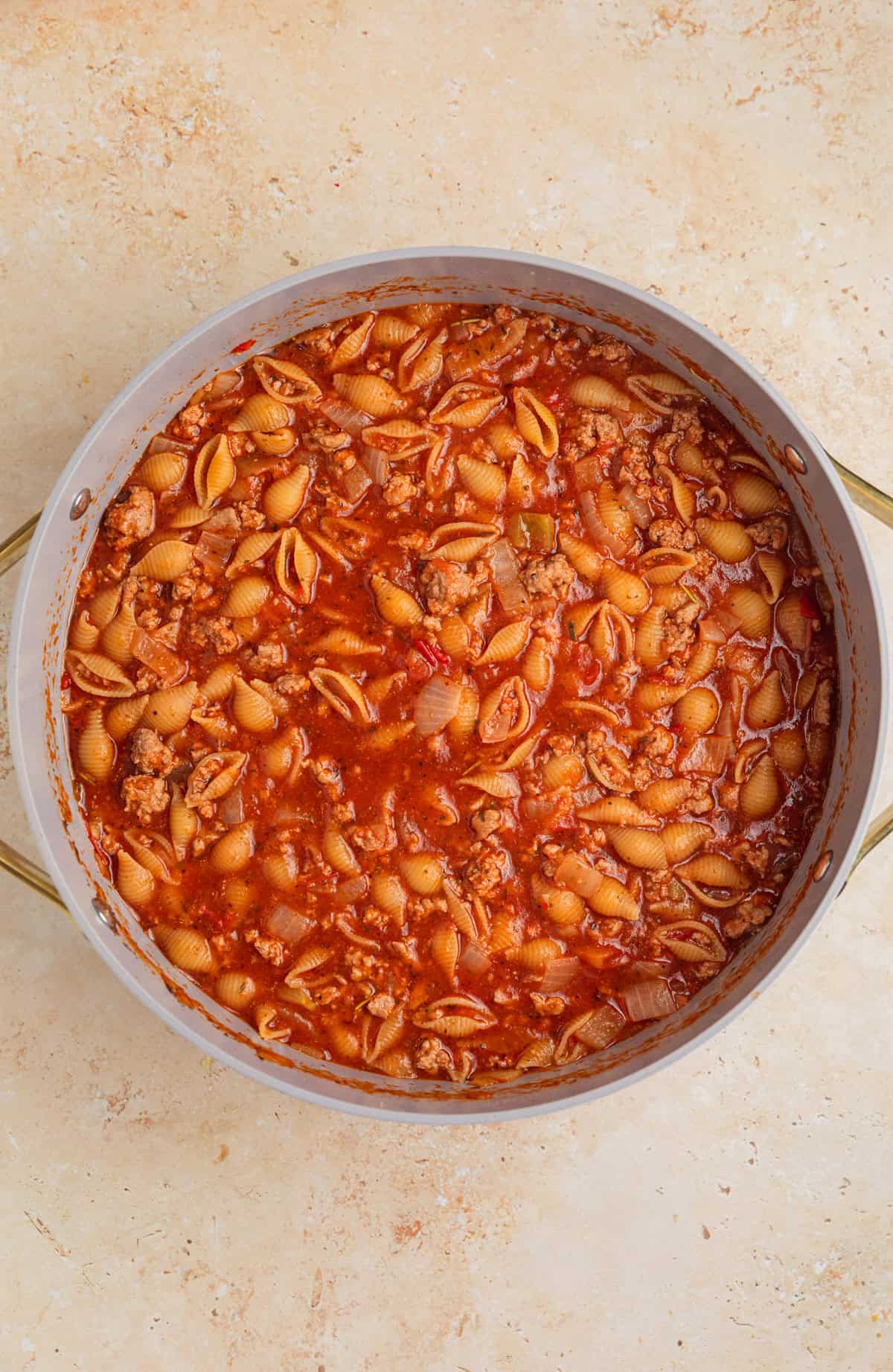 Pasta cooked in one-pot ground turkey pasta in pan.