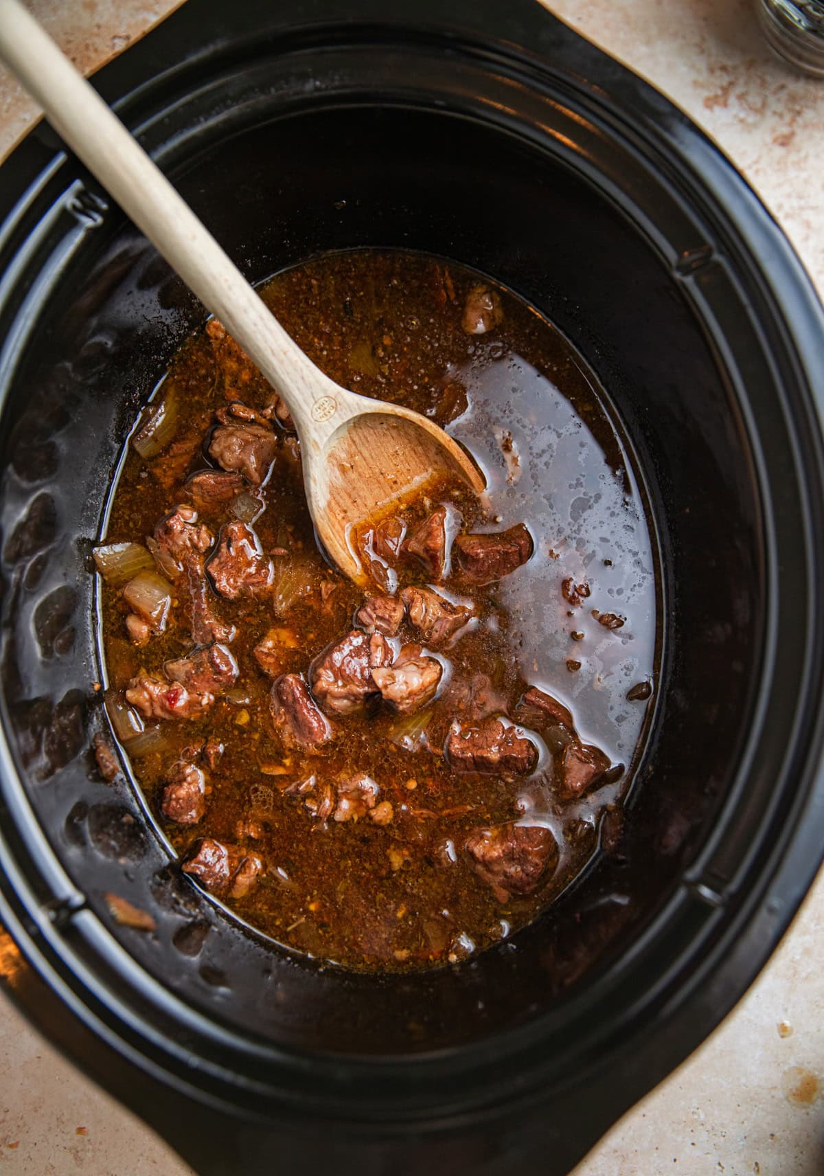 Slow cooker beef tips in gravy prepared.