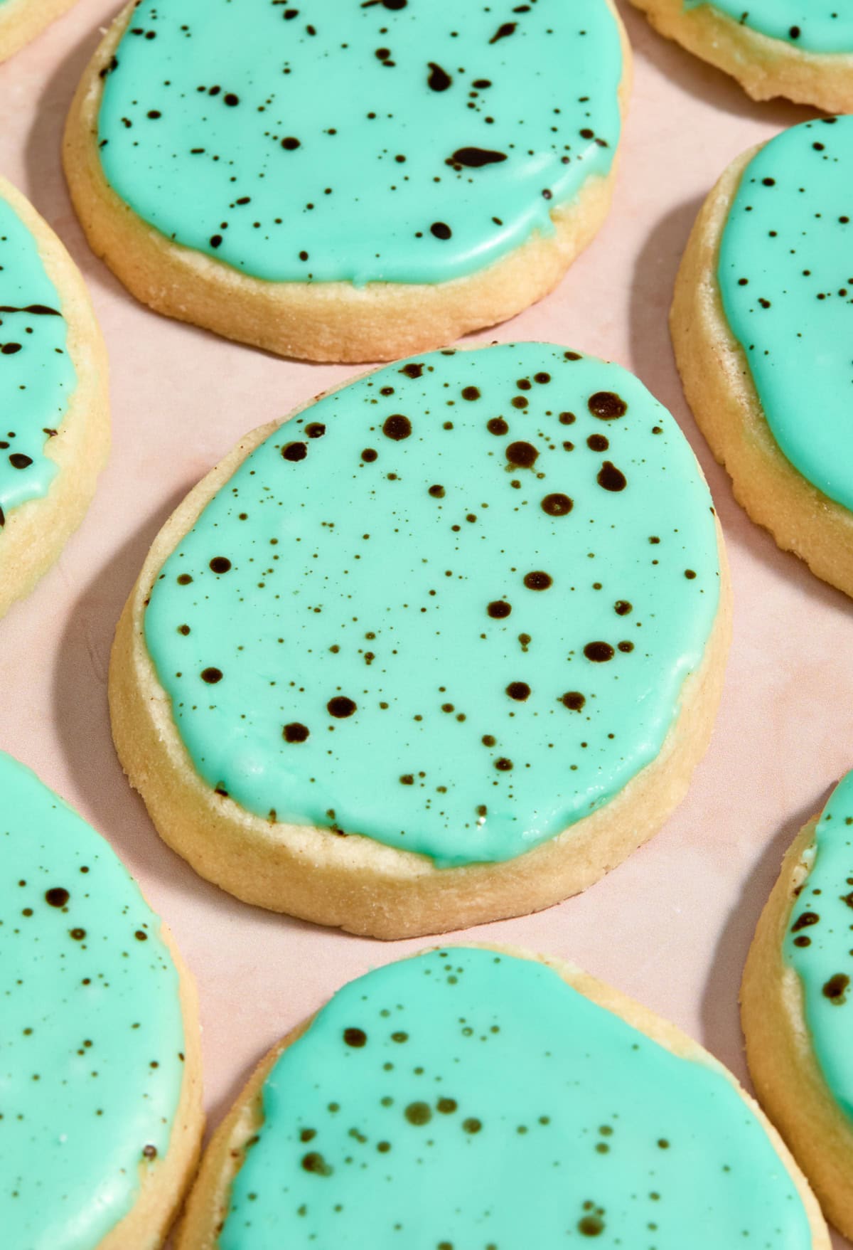 Speckled egg cookies on surface.