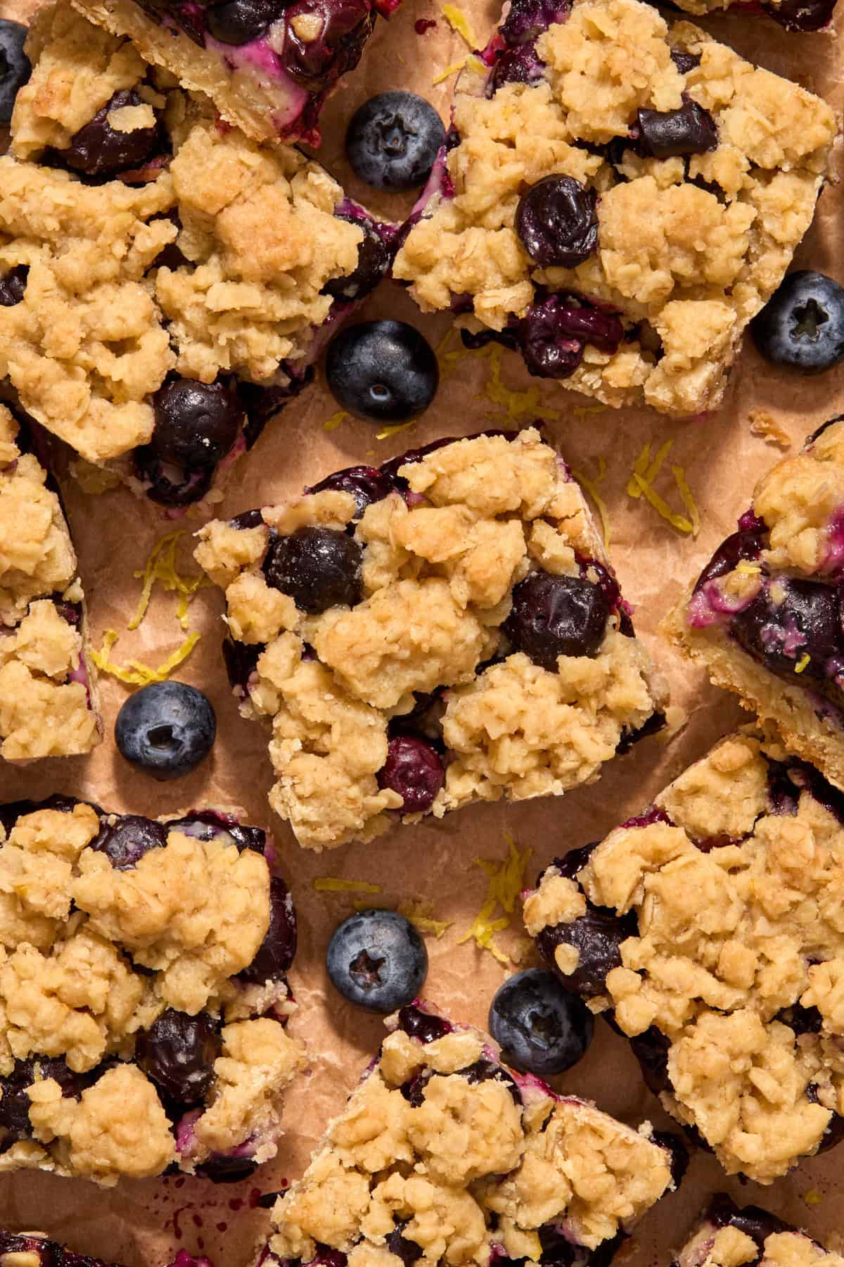 Lemon blueberry oat bars on parchment.