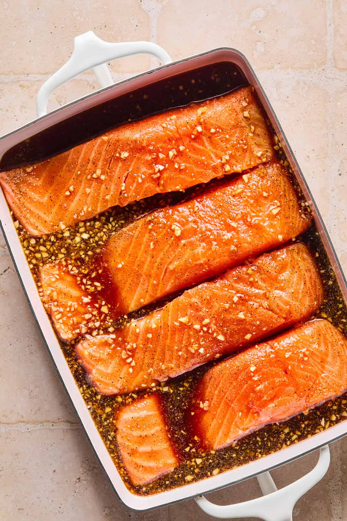 Marinade in shallow dish wth salmon filets.