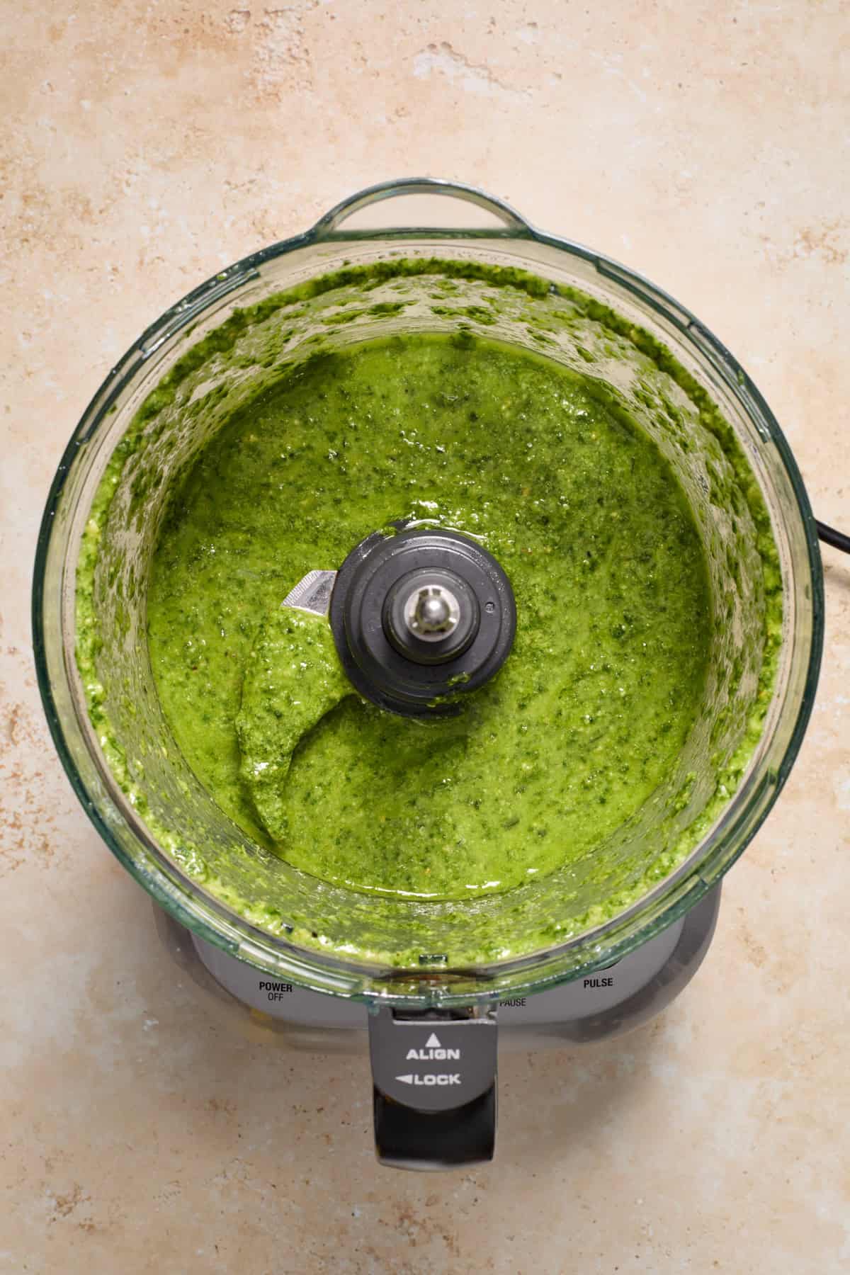 Basil pesto in food processor.