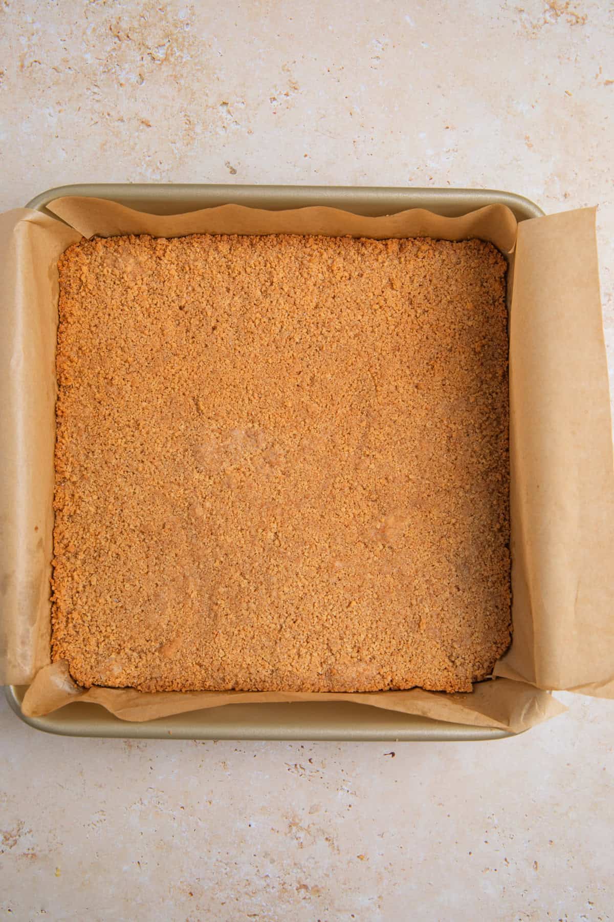 Baked graham cracker crust in pan.