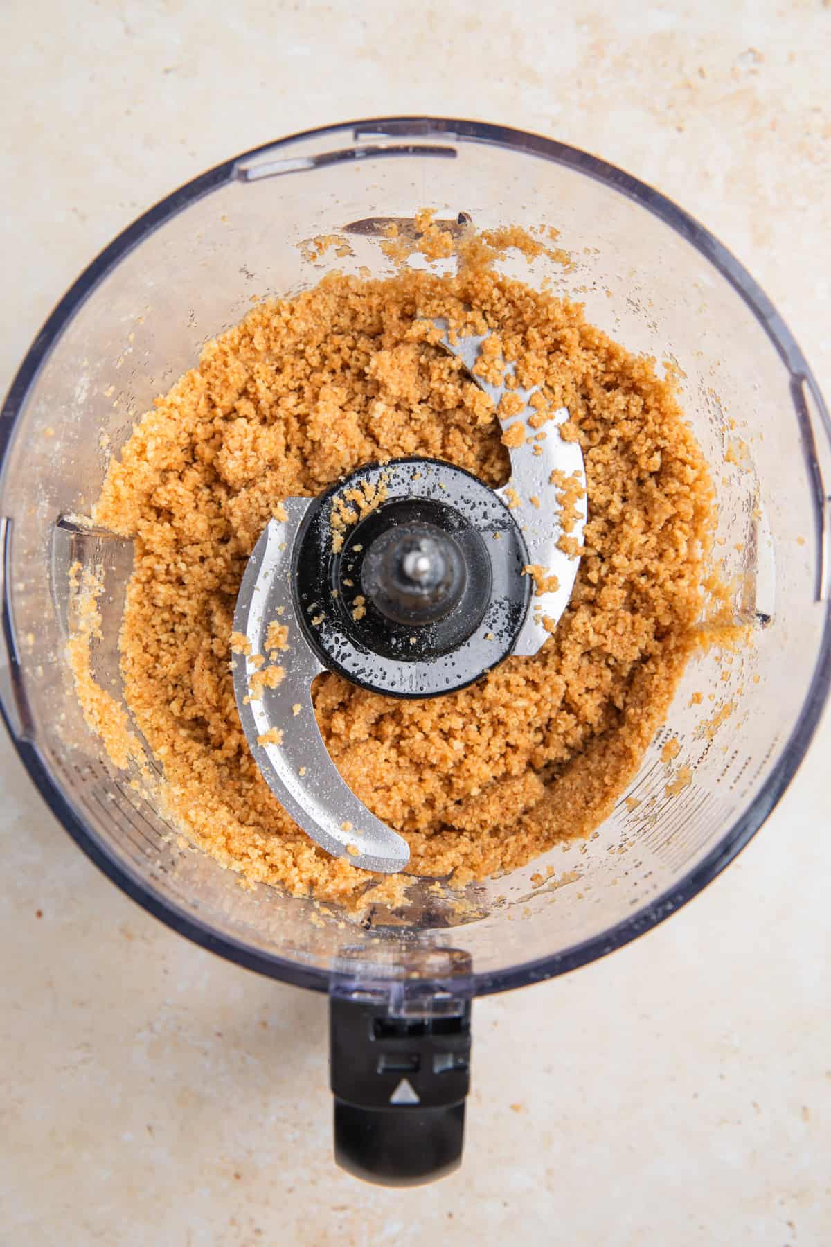 Graham cracker crust mixture in food processor.