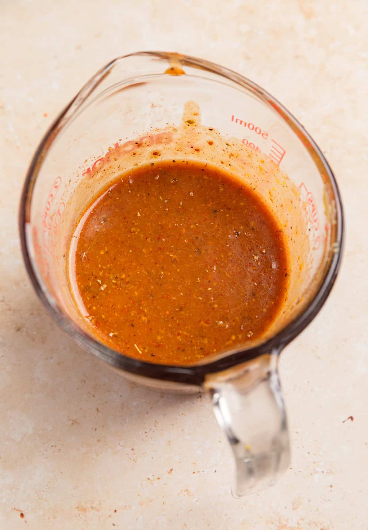Honey mustard marinade in cup.