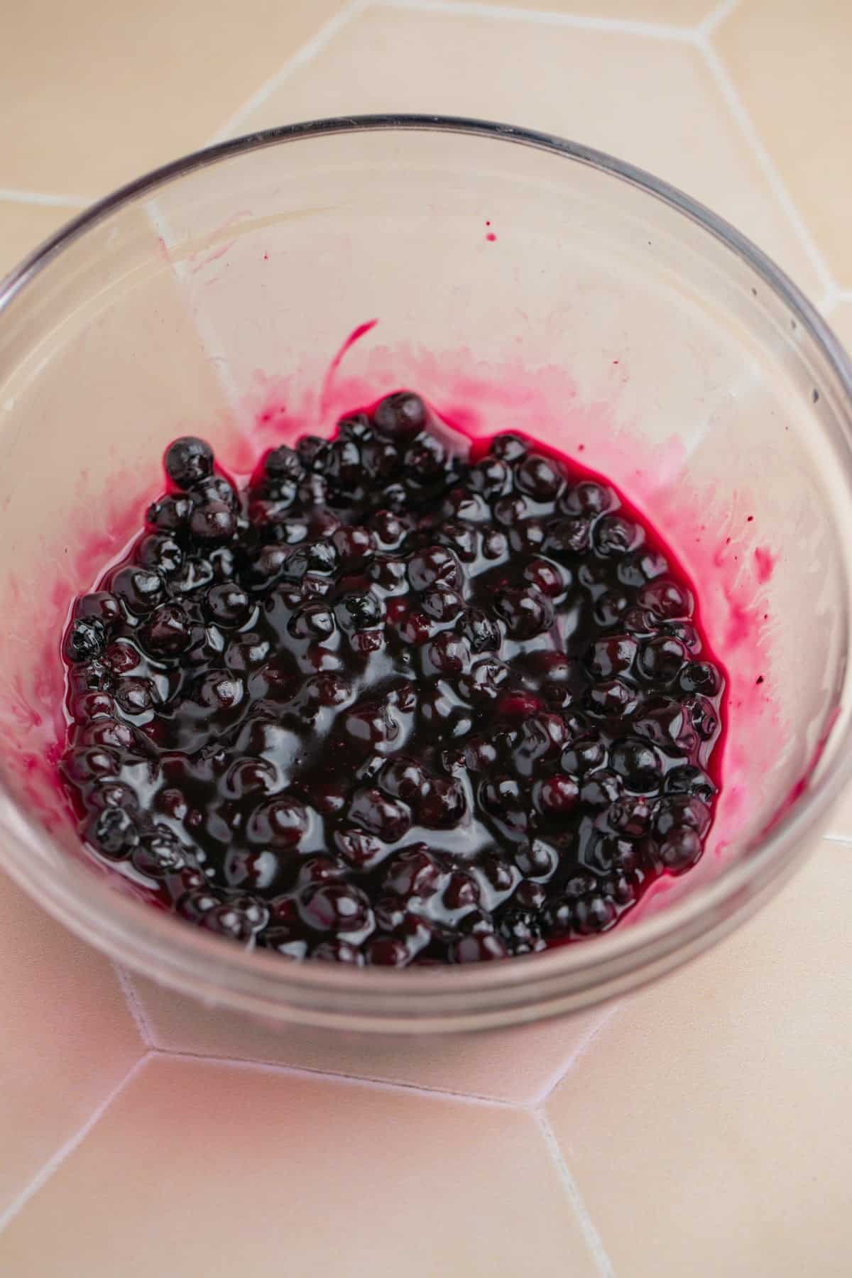 Small bowl with blueberry sauce.