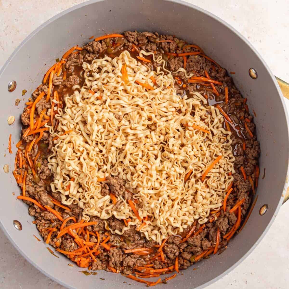 Ramen noodles softened and spread out more in pan.