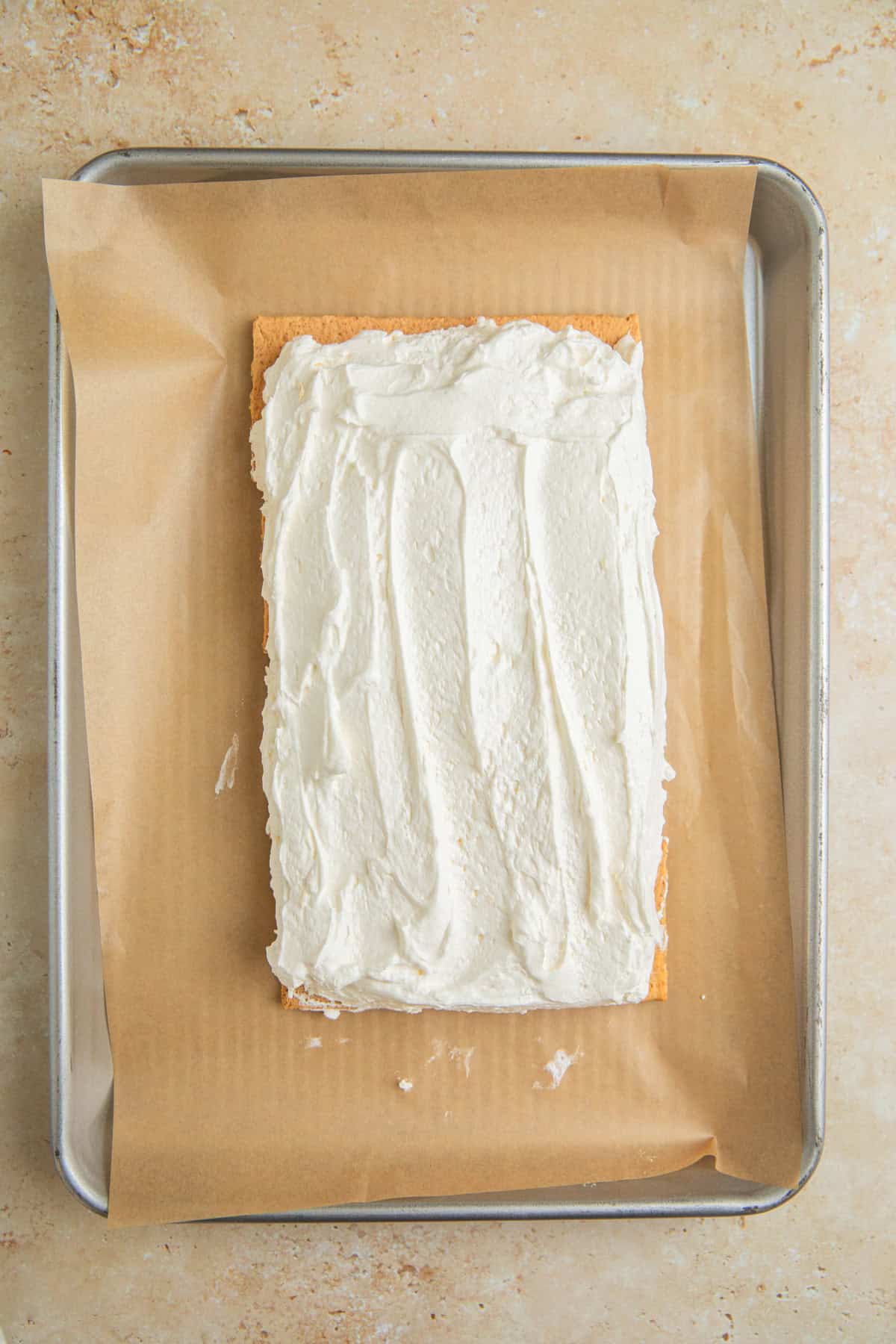 Spread lemonade whipped topping over arranged grahams.