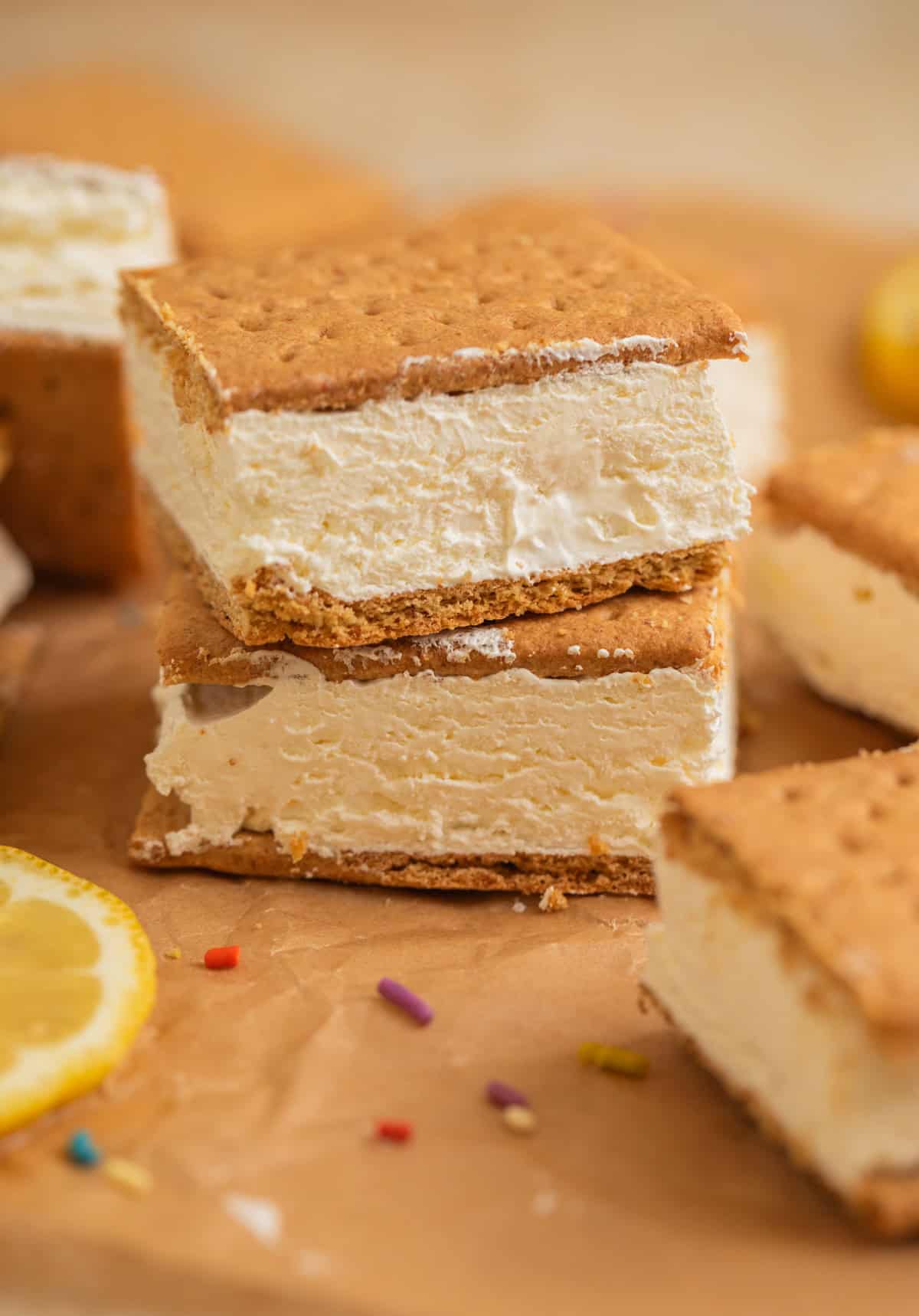 Graham cracker ice cream sandwich squares stacked on each other.