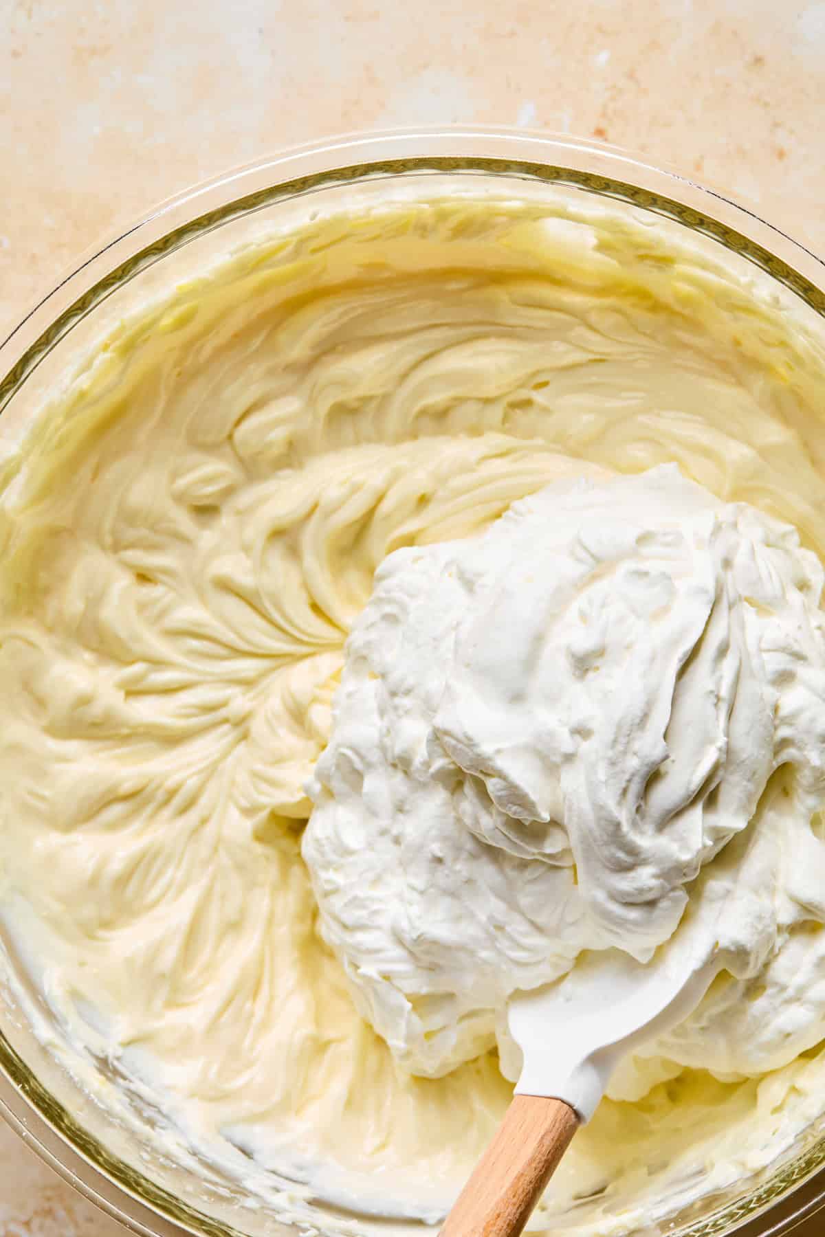 Whipped cream folded into lemon cream cheese mixture.