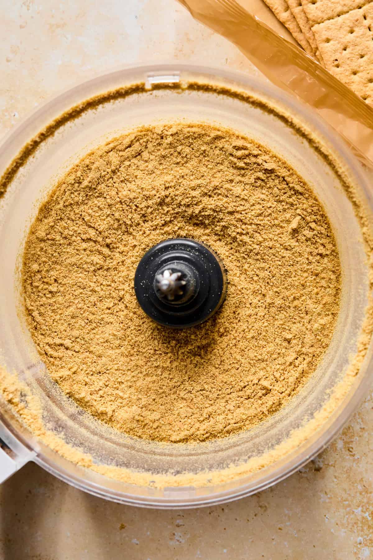 Graham cracker crumbs in food processor.