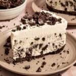 Slice of Oreo ice cream pie on plate.