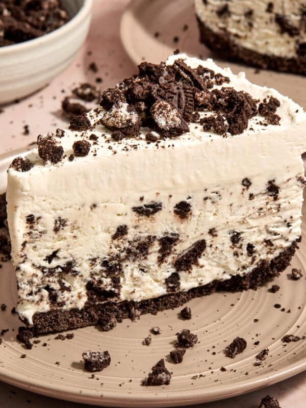 Slice of Oreo ice cream pie on plate.