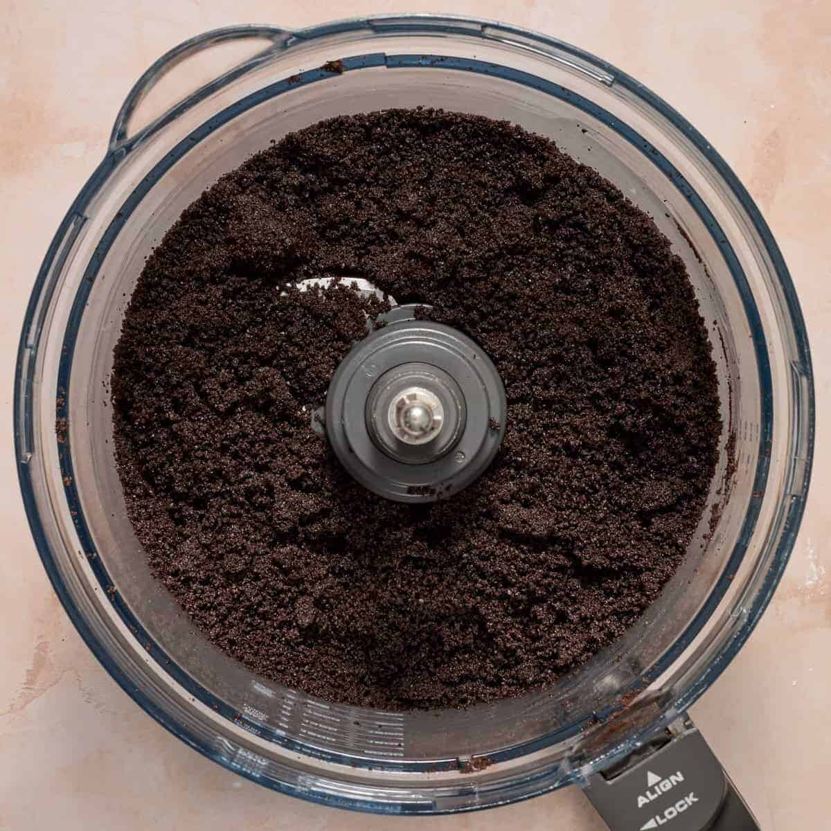 Crushed Oreos with butter and espresso powder in food processor.