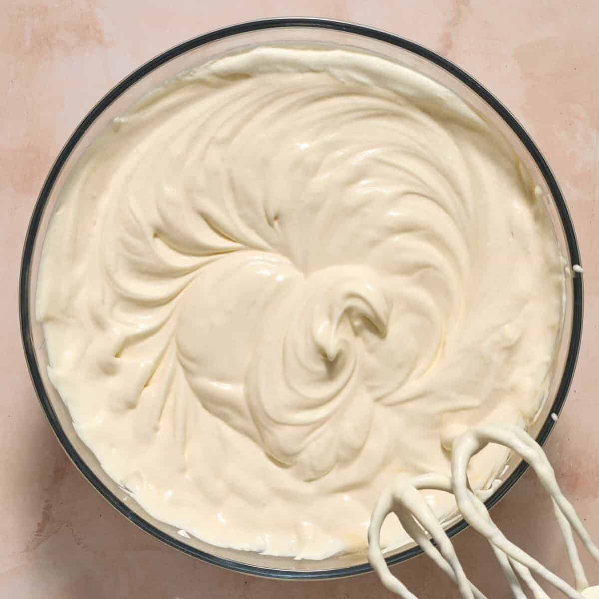 Condensed milk, sour cream and vanilla mixed into whipped cream.