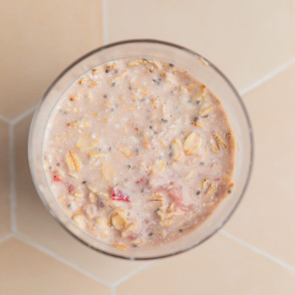 Stirred overnight oatmeal mixture in jar.