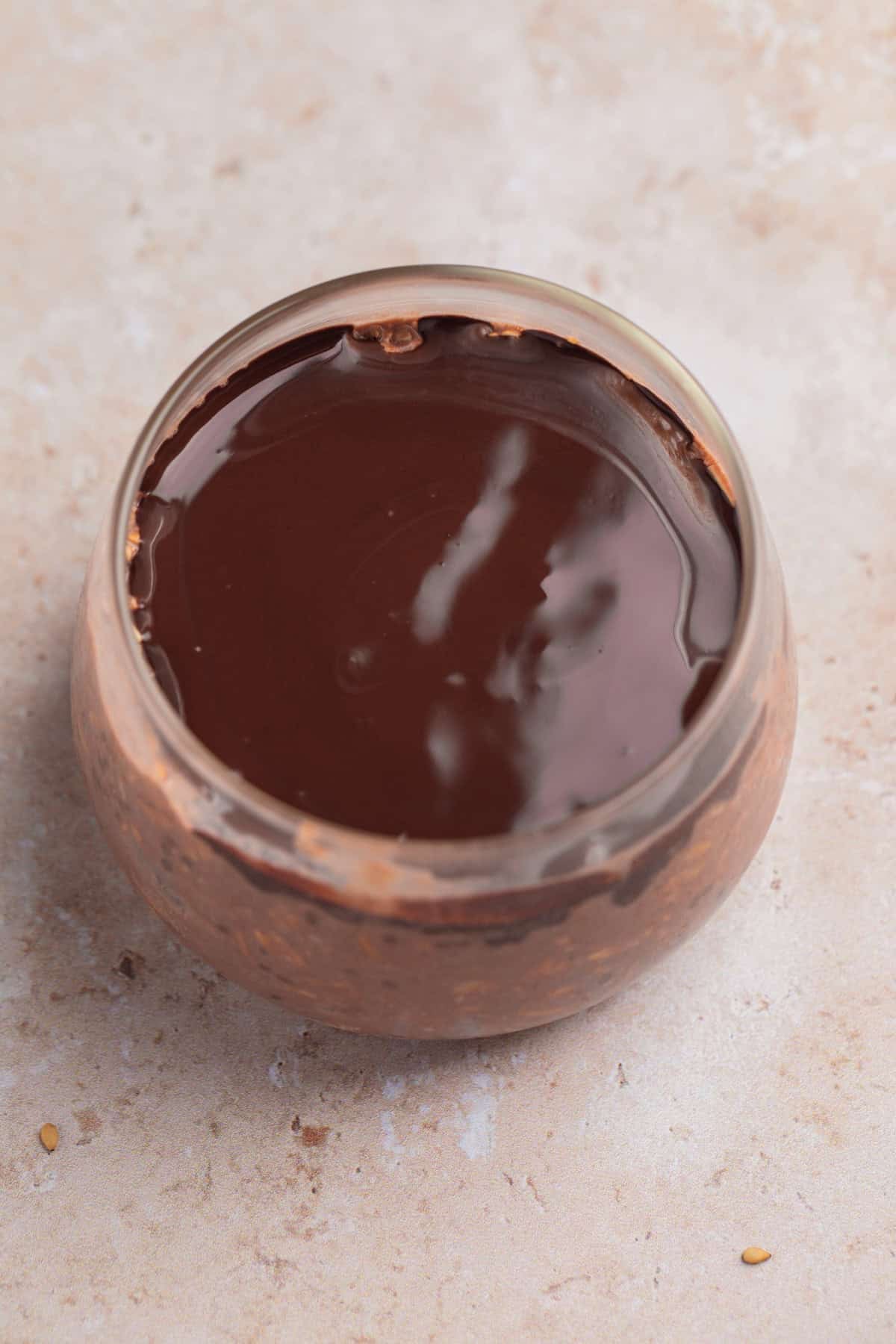 Melted chocolate over chocolate oatmeal.