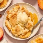 Cheesecake cobbler dessert served on plate with fork.