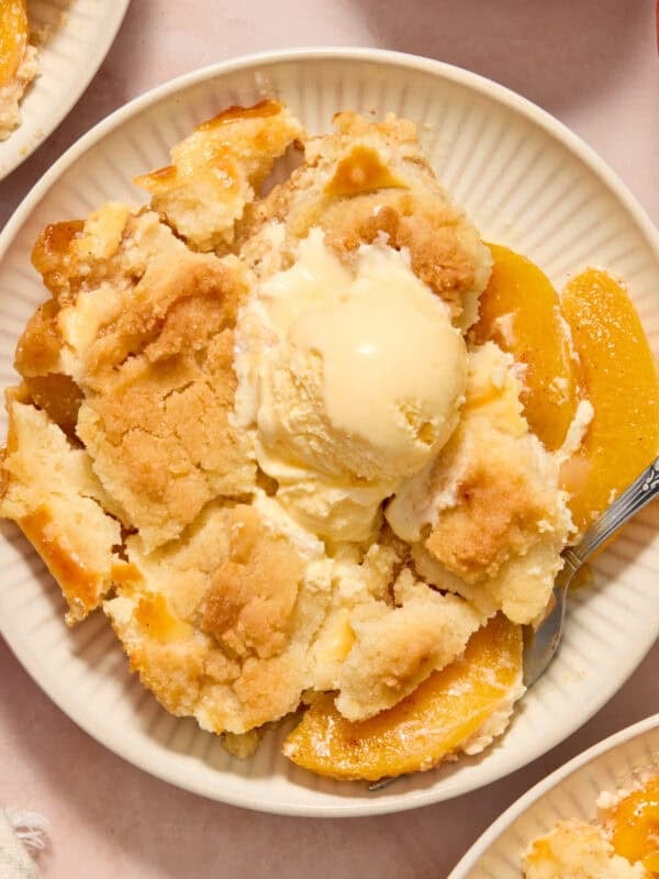 Cheesecake cobbler dessert served on plate with fork.