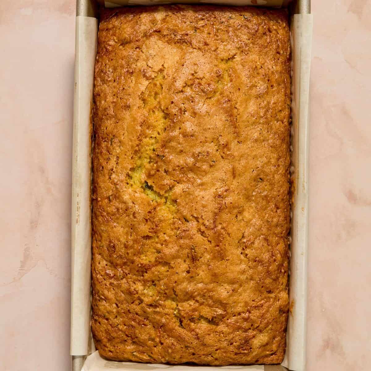 Baked lemon zucchini loaf in pan.