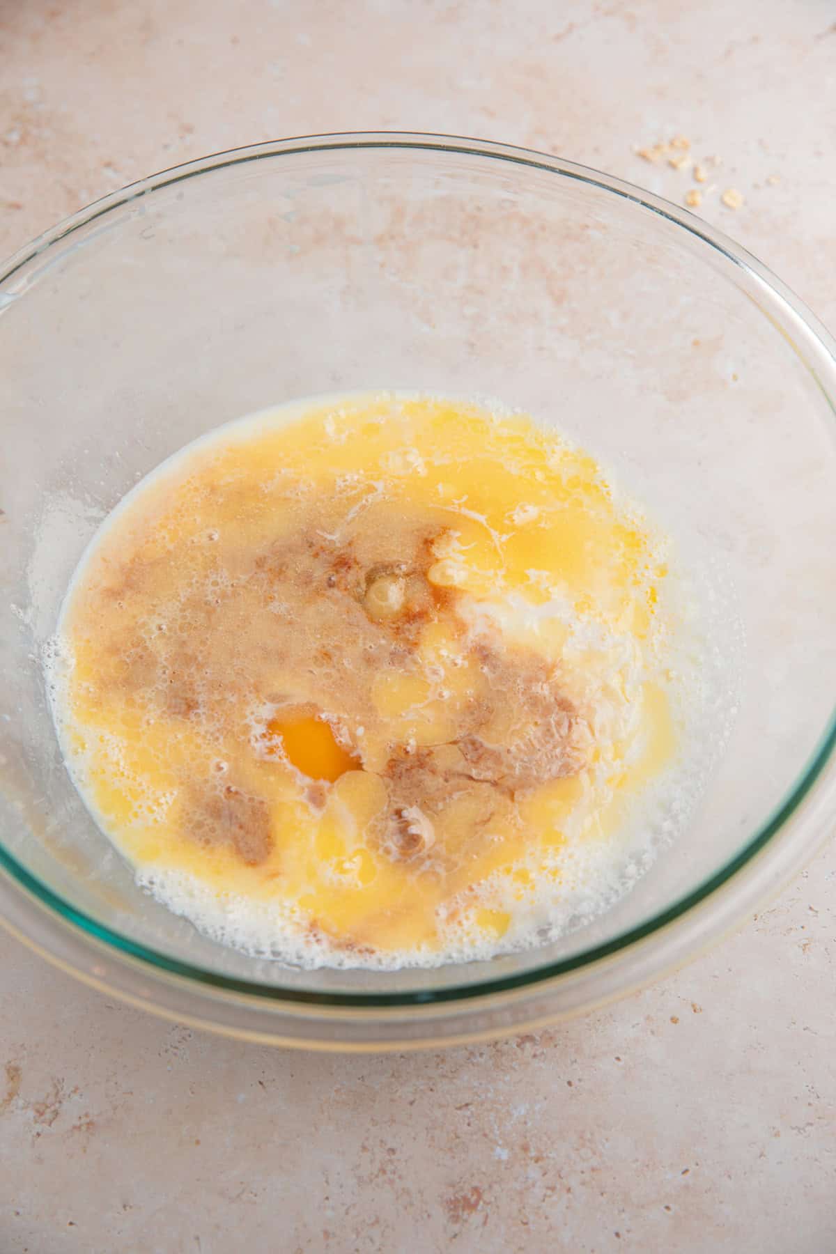 Wet ingredients added to glass bowl before mixing.