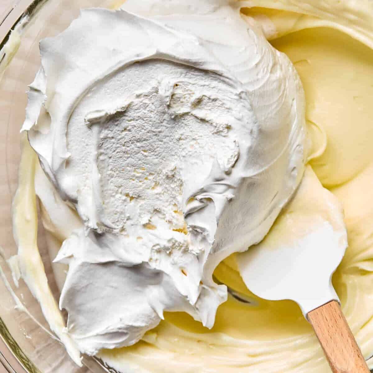 Cream cheese mixture with cool whip added on top.