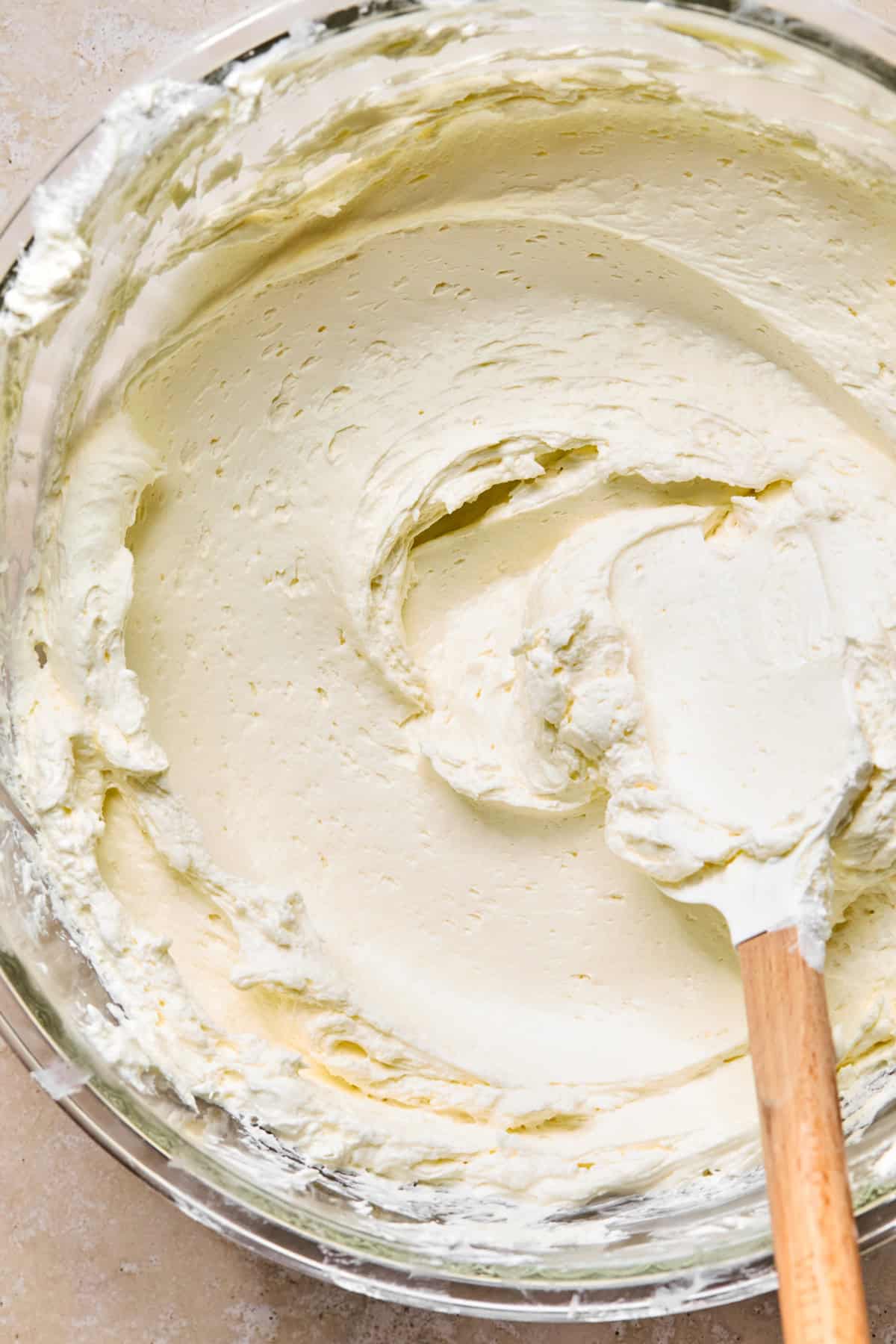 No-bake cream cheese mixture in bowl with spatula.