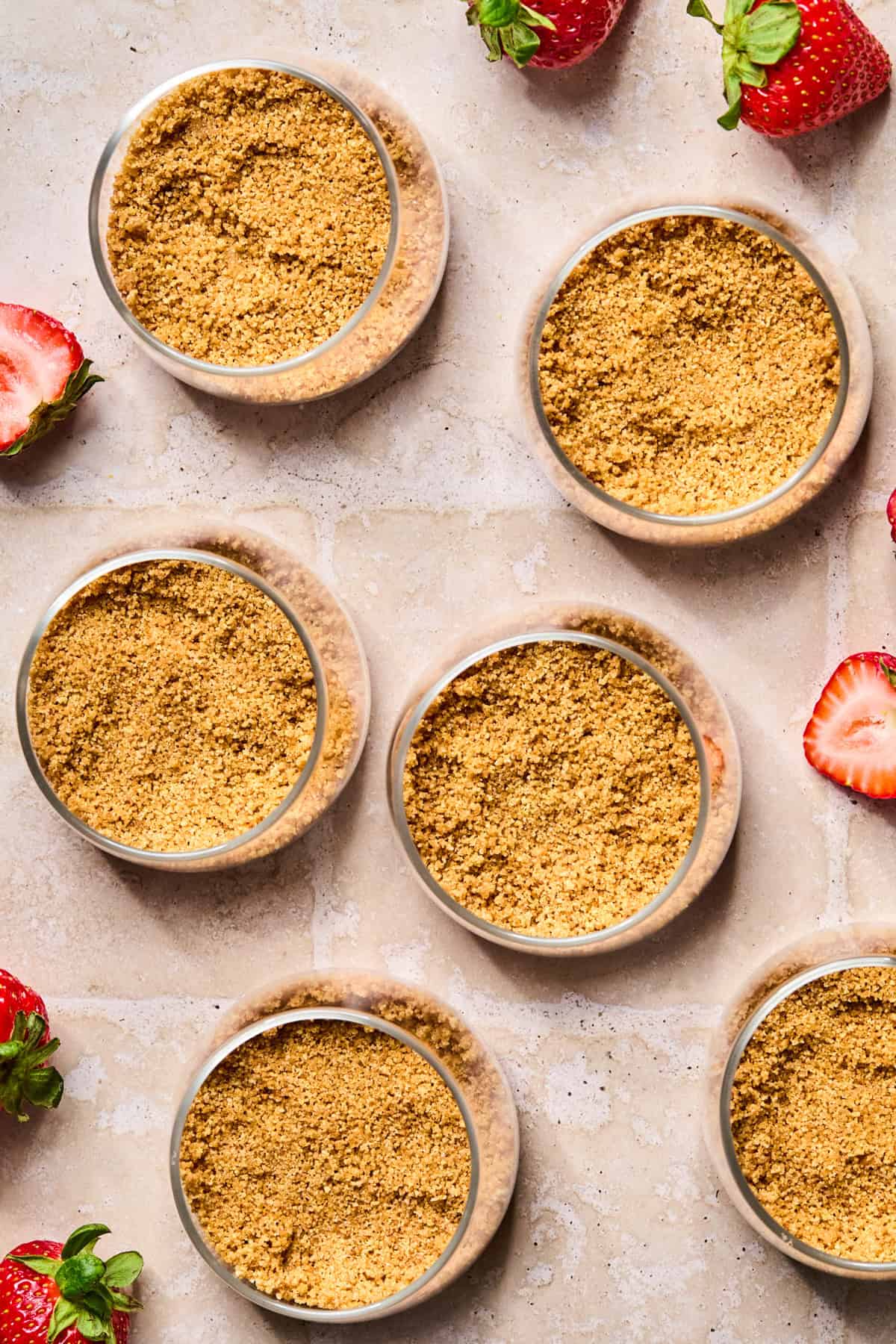 Graham cracker crust added to bottom of dessert dishes.