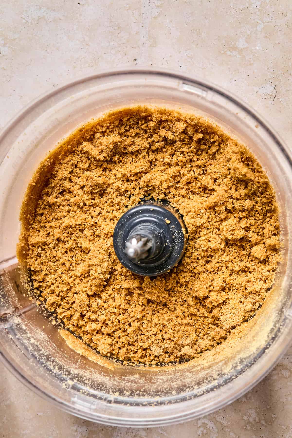Graham cracker crust mixture in food processor.