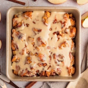 Apple pie biscuit bake in pan with icing.