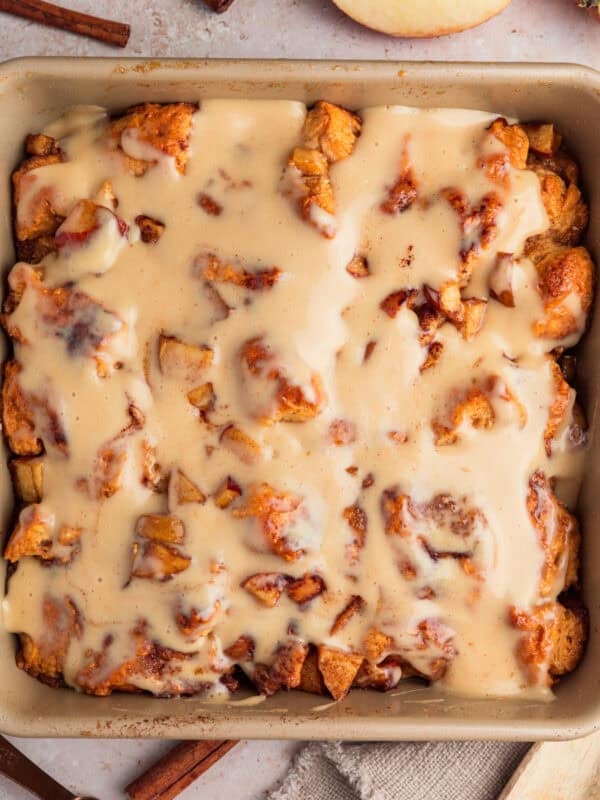 Apple pie biscuit bake in pan with icing.