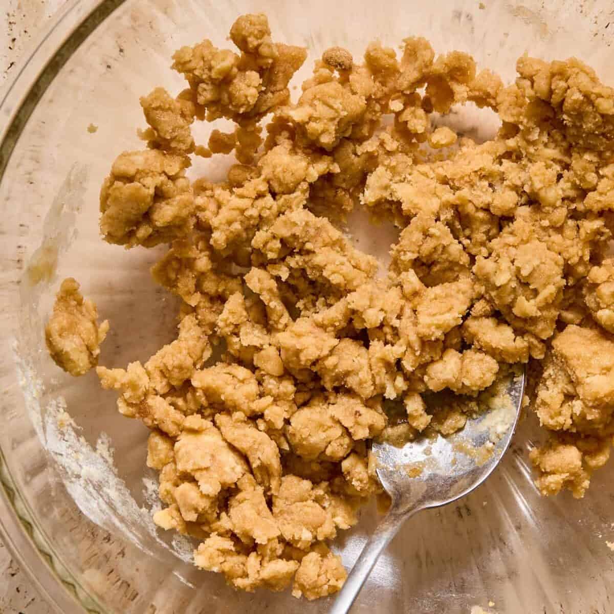 Cobbler mixture in glass bowl with spoon.