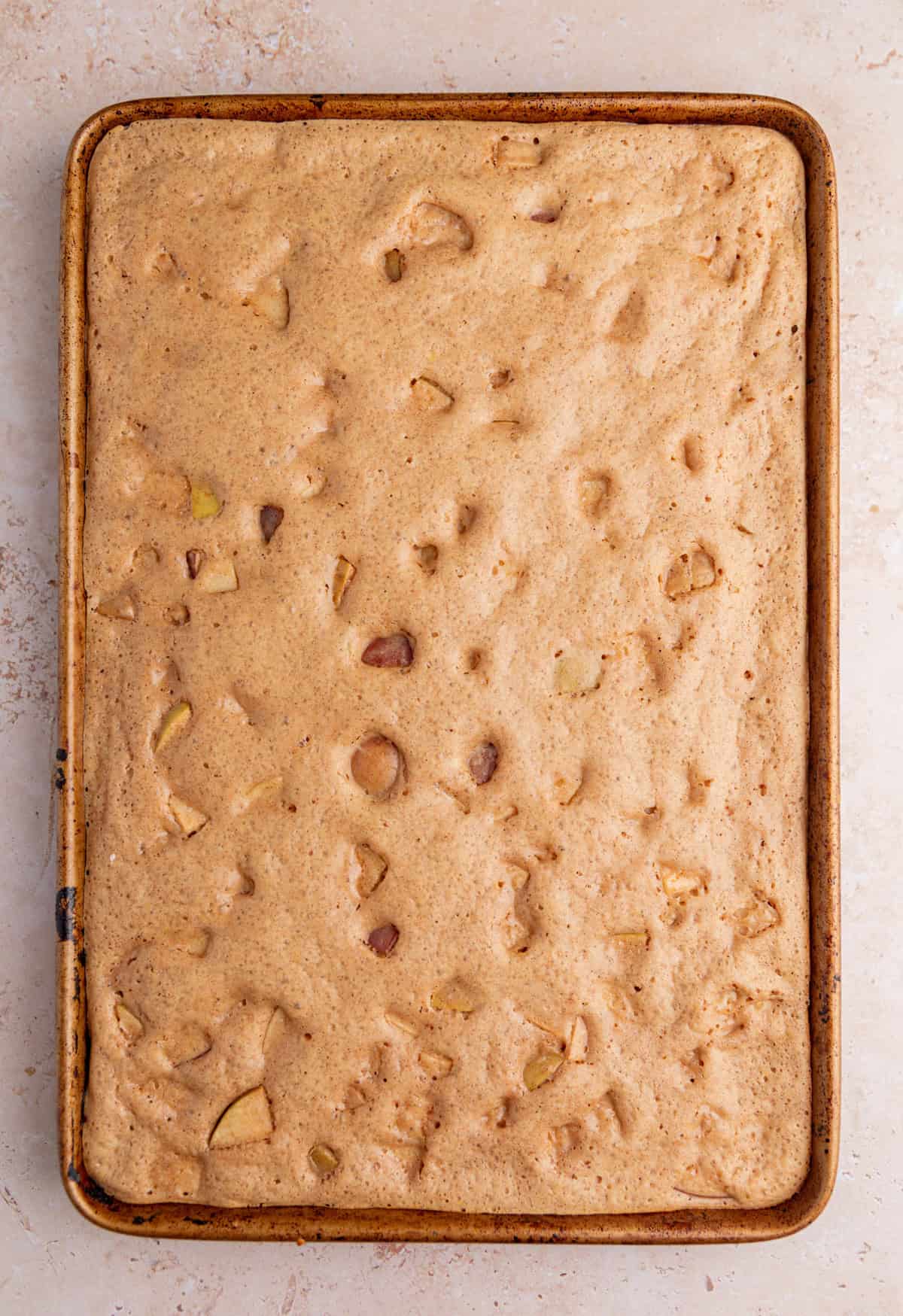 Baked apple cinnamon pancake on sheet pan.