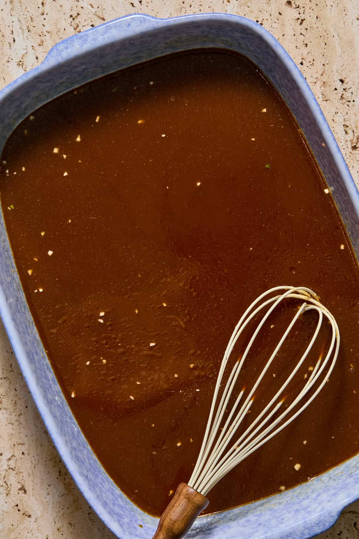 Whisked ramen sauce ingredients in pan.