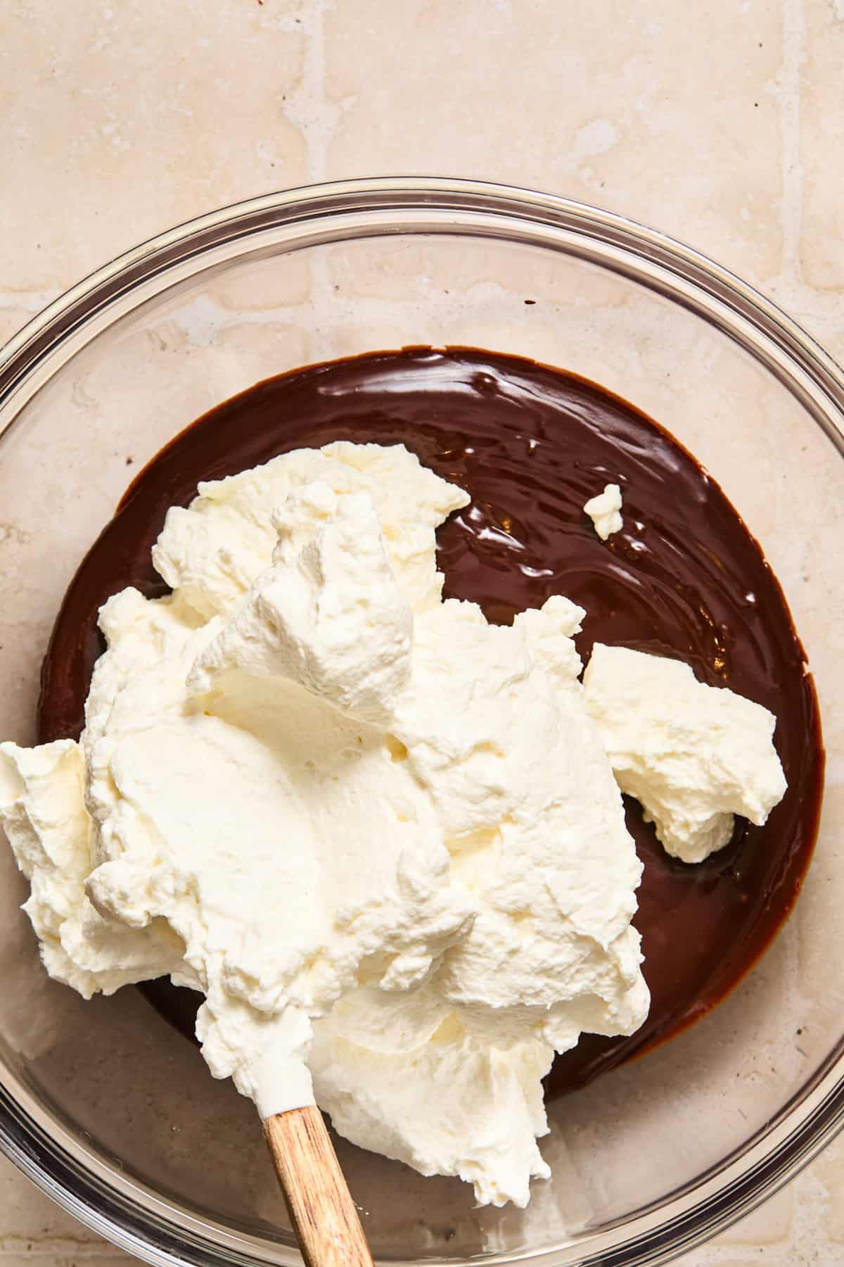 Whipped cream added to cooled chocolate espresso martini ganache.