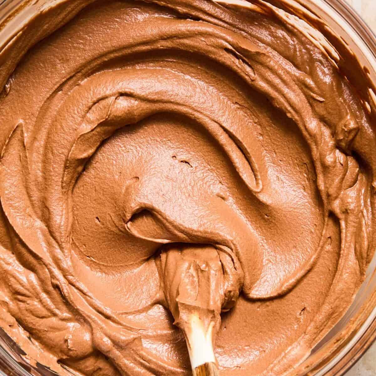 Chocolate espresso martini cream filling in bowl with spoon.