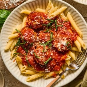 Ricotta chicken meatballs on pasta with marinara sauce.