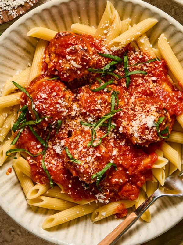 Ricotta chicken meatballs on pasta with marinara sauce.