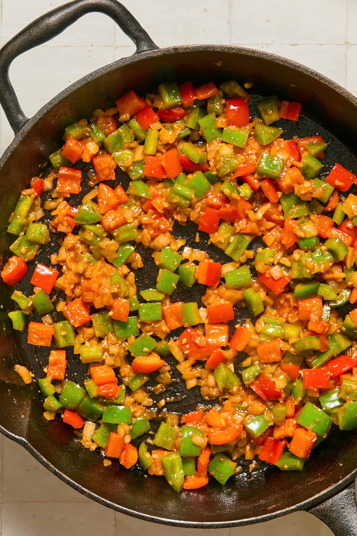 Sautéed onions and peppers in cast iron skillet.
