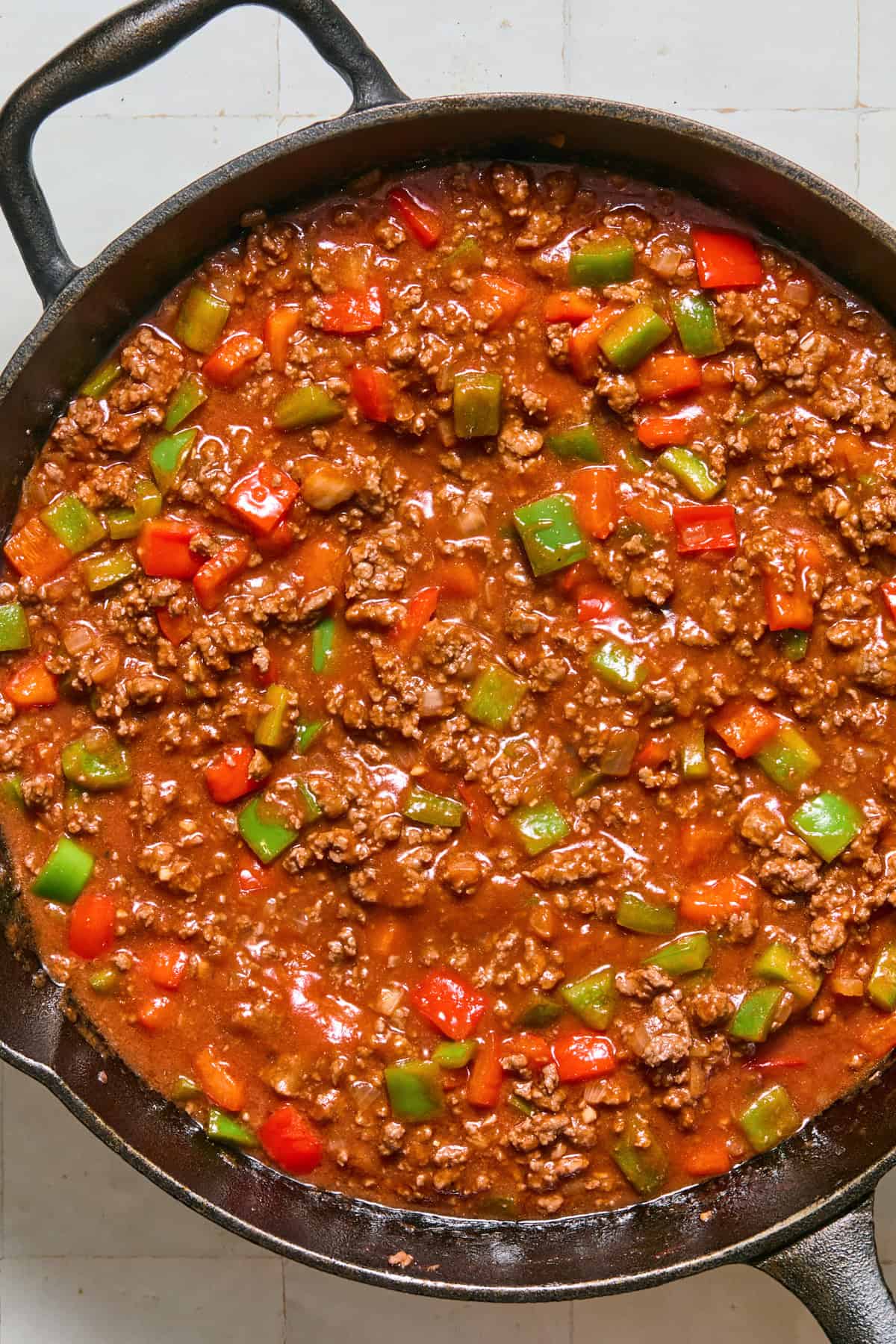 Simmered sloppy joe mixture in skillet.