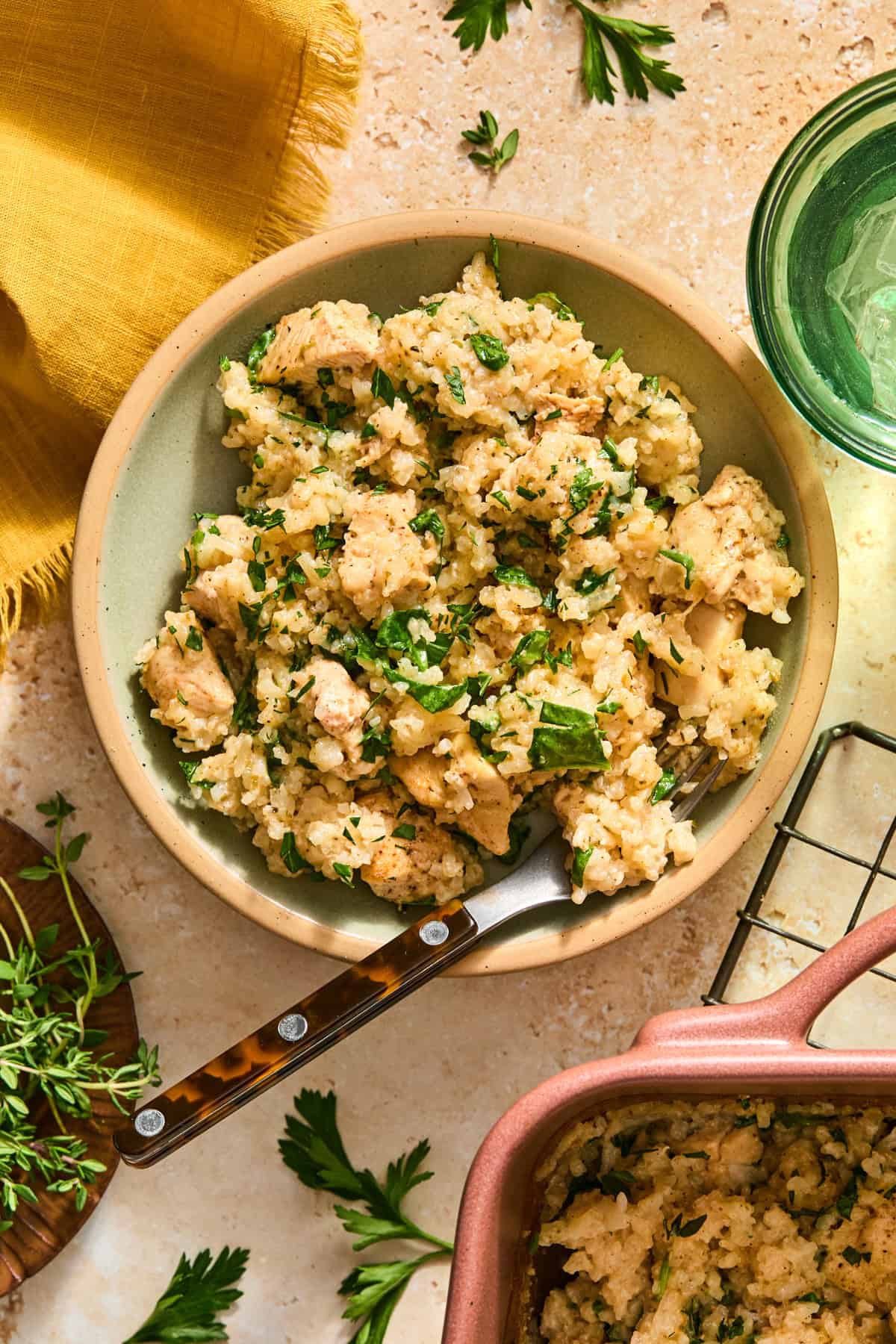 Bowl with chicken and rice bake with fork propped in.