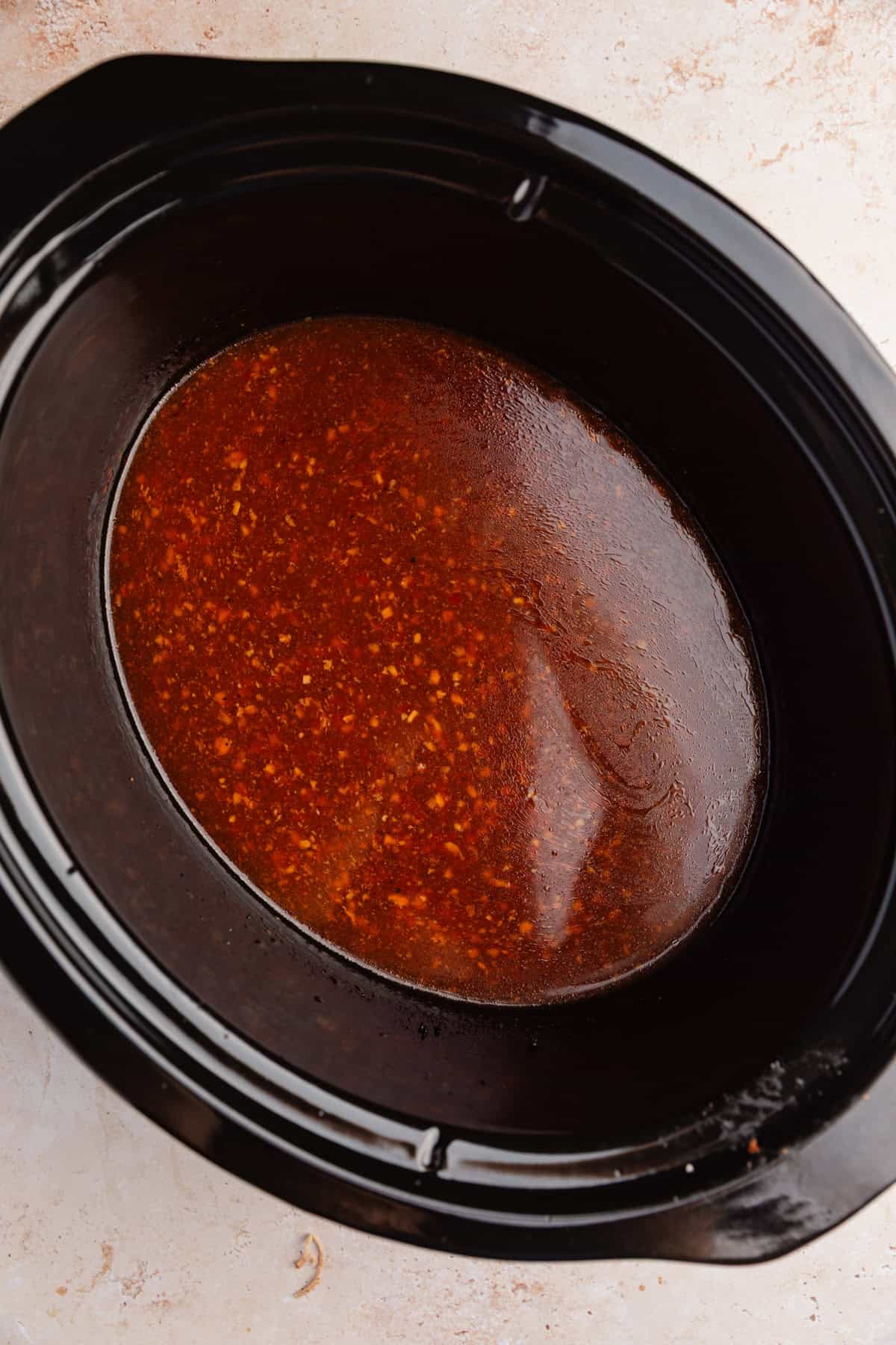 Sauce with cornstarch slurry in slow cooker.