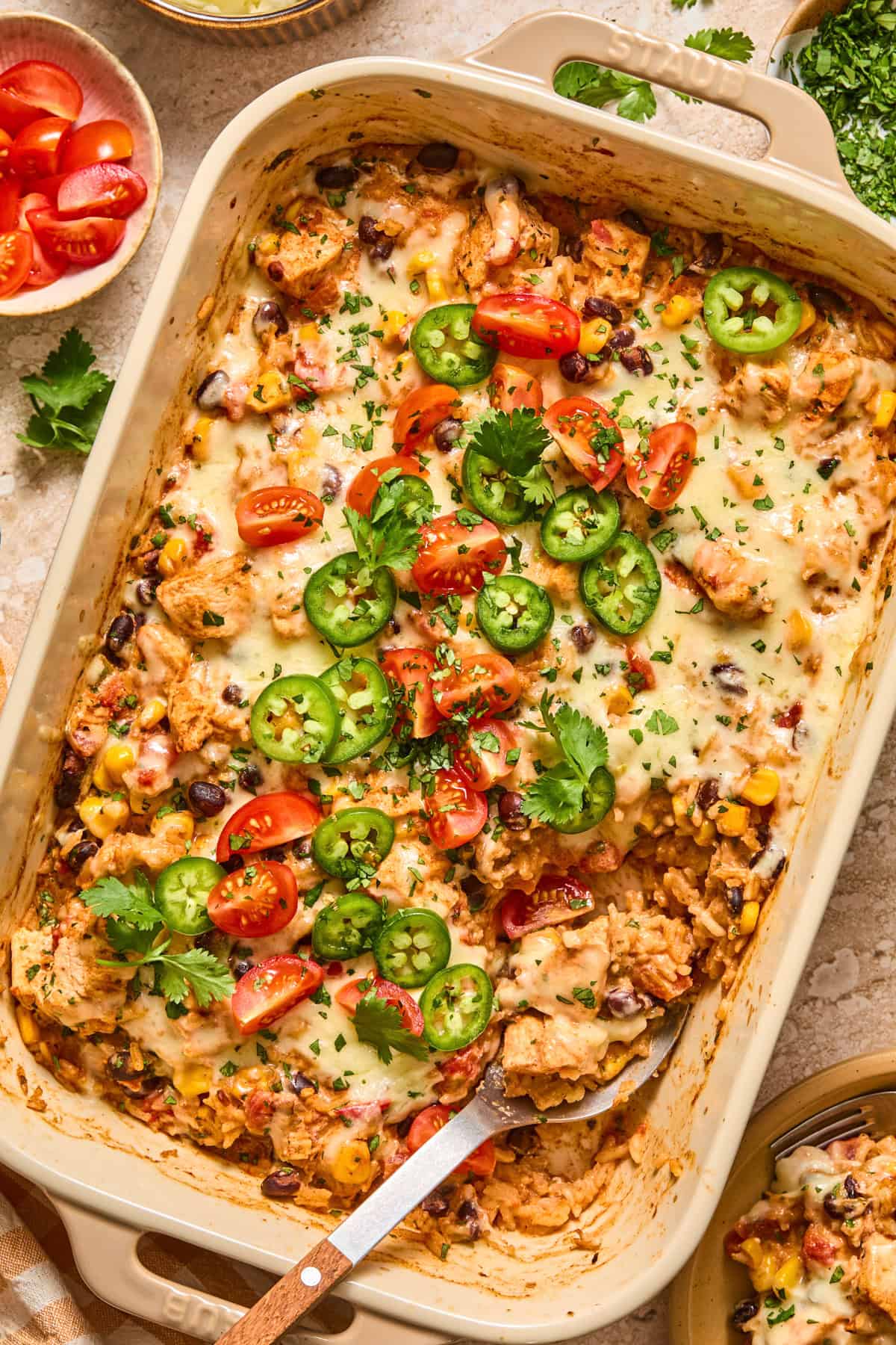 Chicken taco rice bake with serving spoon.