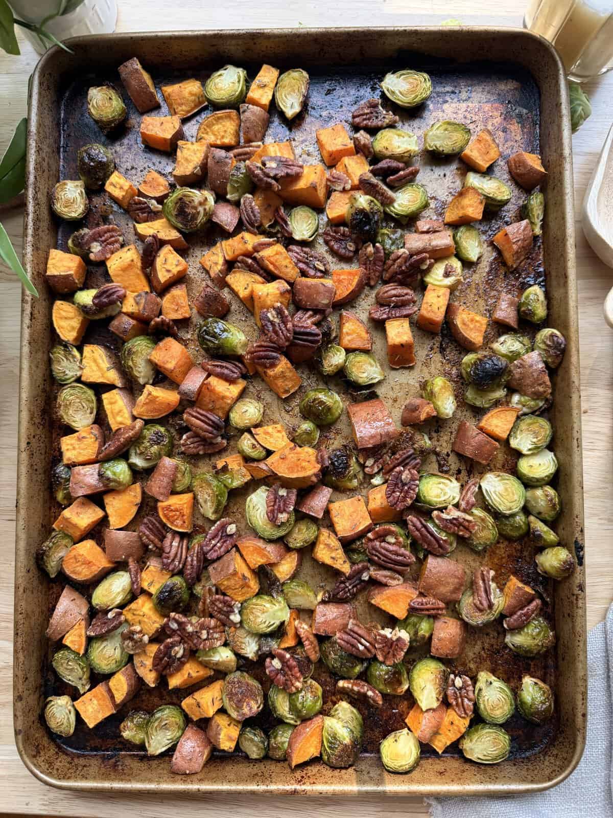 Roasted maple dijon sweet potatoes and brussels sprouts with pecans.