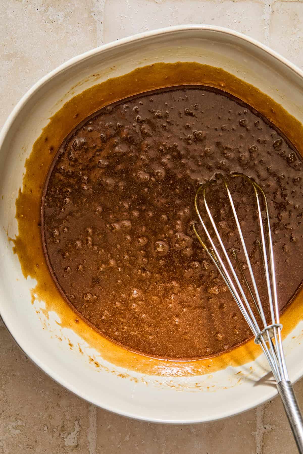 Maple brown sugar cookie wet mixture in bowl.