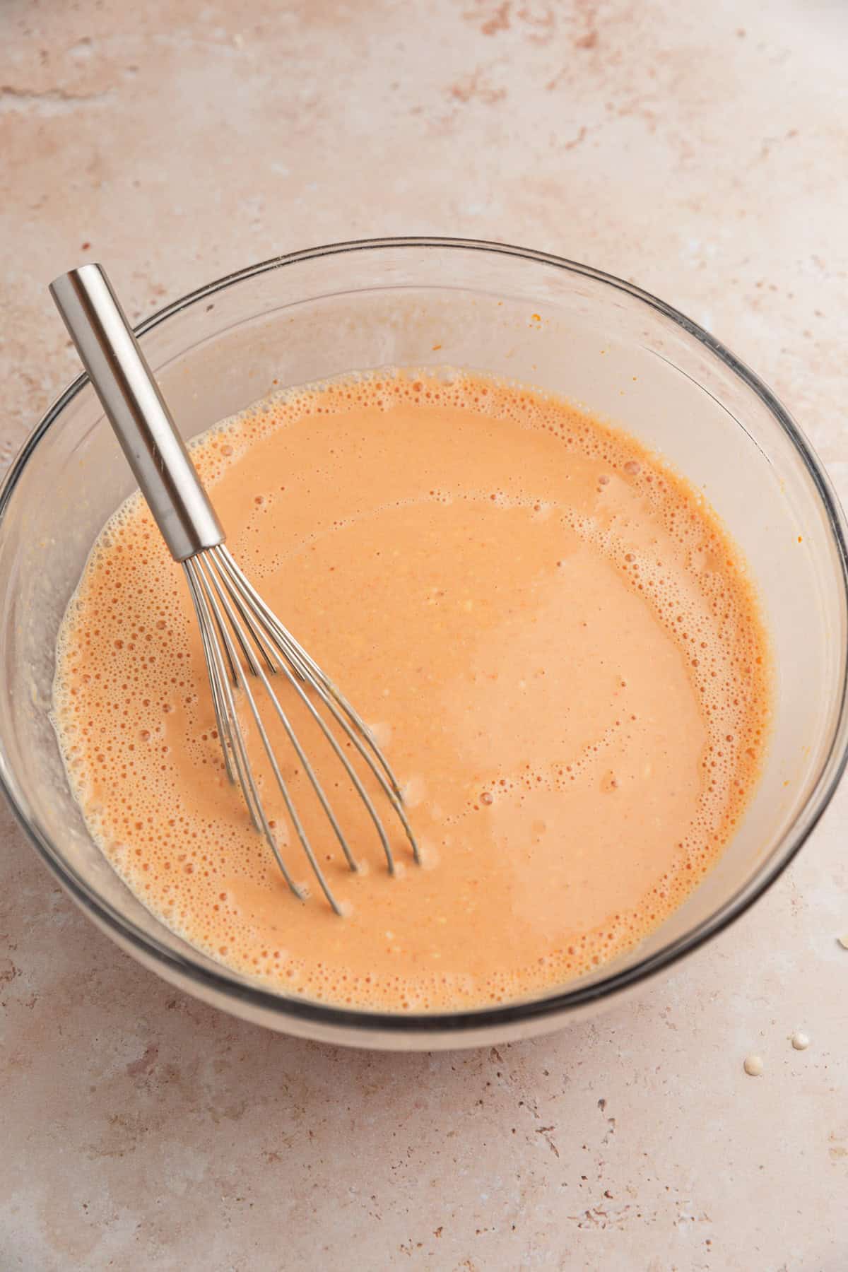 Wet ingredients for pumpkin ricotta pancakes in bowl.