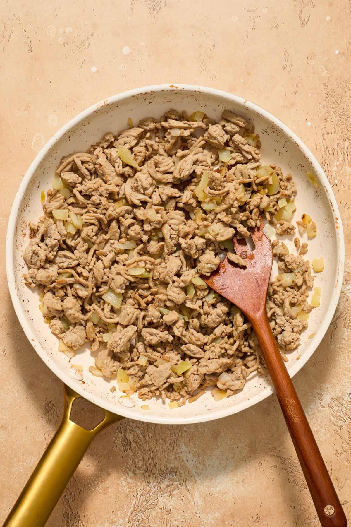 Browned ground turkey and onions in skillet.
